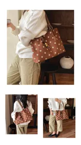 Detailed shot of the stylish brown polka dot tote bag showcasing its large capacity and design.
