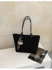 Black canvas tote bag for women, large capacity minimalist casual shoulder bag with cute bear charm.