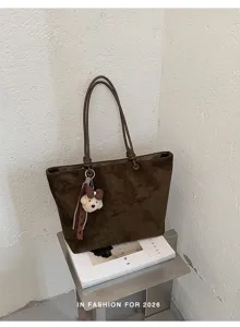 Stylish brown suede tote bag with cute bear charm, large capacity and elegant design for women.