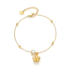 Brazalete de acero de titanio dorado con corazón de cristal y colgante de flor mujer.