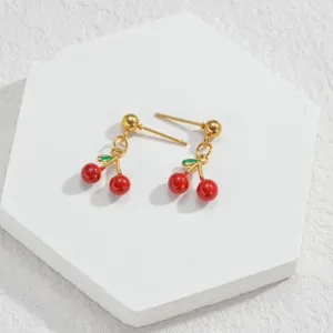 Gold-plated cute red cherry stud earrings with green enamel leaves, elegant daily jewelry.