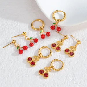 Golden cherry drop earrings set featuring vibrant red enamel and sparkling rhinestone designs.