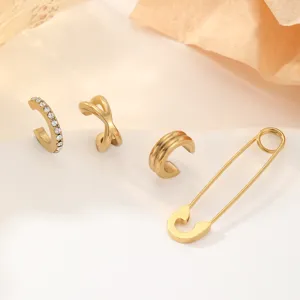 Ensemble de earcuffs en acier inoxydable doré avec strass, croix et épingle de sûreté.