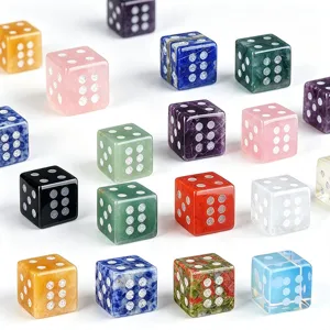 Closeup of vibrant natural gemstone dice, displaying unique crystal textures and polished surface.