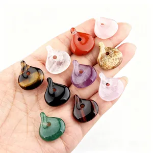 Detail view of multi-color natural gemstone twisted pendant charms for DIY jewelry making.