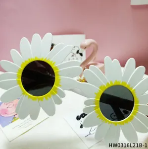 Close-up detail of white daisy flower party sunglasses, showcasing unique floral frames.