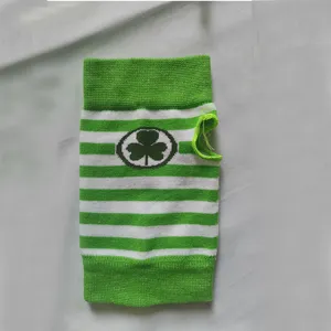 Detailed view of St. Patrick's Day green white striped knit arm sleeve with shamrock.