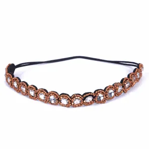 Vintage bronze rhinestone headband detail shot, crystal beaded elastic hair accessory.