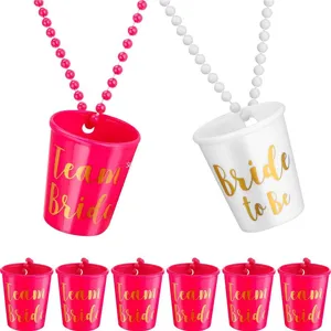 Bachelorette party bead necklace set with Team Bride and Bride to Be shot glasses.