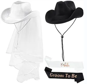 Detailansicht der Bachelorette Party weiße und schwarze Cowboyhüte mit Schleier.