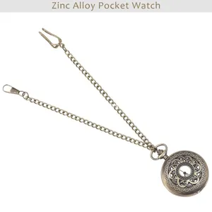 Detail view of vintage bronze zinc alloy pocket watch with chain and clip for retro fashion style