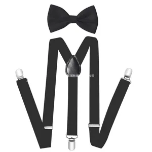 Men black bow tie and suspenders set classic gentleman fashion accessory detail view.