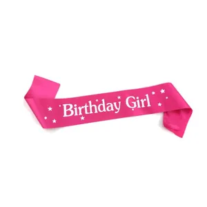 Pink birthday girl satin sash detail showing elegant white font and lovely star print patterns.