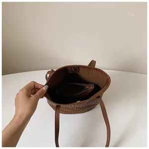 Interior detail shot of brown woven tote bag with matching pouch, clean minimalist style.