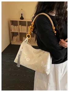 New Chinese style women shoulder bag, vintage satin handbag with beaded handle and tassel detail.