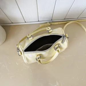 Yellow polka dot boston shoulder bag, chic PU leather pillow handbag with zipper and straps.