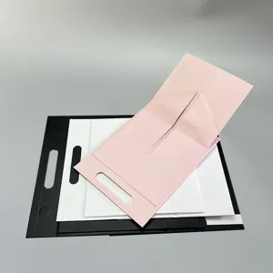 Zusammenklappbare einteilige tragbare Geschenkbox Detail mit rosa weisser und schwarzer Verpackung