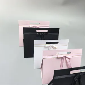 Foldable portable gift box with elegant bow, premium cosmetic packaging in multiple chic colors.