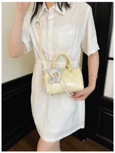 Stylish yellow polka dot pillow shoulder bag with lace pendant, trendy daily casual handbag.