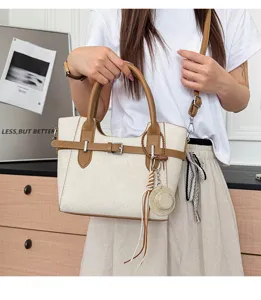 Retro contrast color women shoulder crossbody bag with buckle detail and cute straw hat charm.