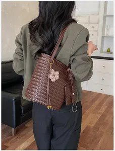 Woven tote shoulder bag with detachable pouch detail, stylish daily commute handbag.