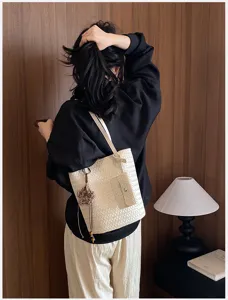 Chic woven tote bag for women, stylish minimalist shoulder bag for daily commute.