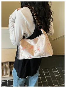 Chic Chinese style brocade shoulder bag detail showcasing vintage floral pattern and wood beads.