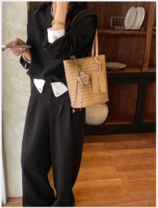 Chic woven tote bag for women, trendy commuter shoulder handbag with small pouch and floral charm.