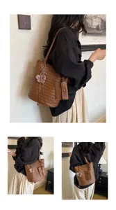 Woven leather bucket shoulder bag for women, stylish brown casual daily tote handbag.