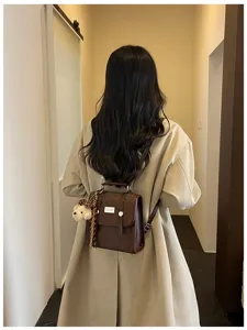 Stylish brown leather backpack for women, college style daily commuting schoolbag.