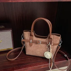 Retro brown contrast color women's shoulder crossbody bag with chic decorative hat pendant.