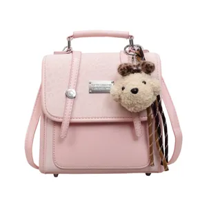 Pink mini backpack for women, cute school bag with bear pendant, stylish casual daypack.