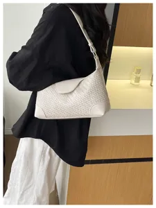 Chic woven leather shoulder bag for women, stylish underarm hobo bag for daily commute.