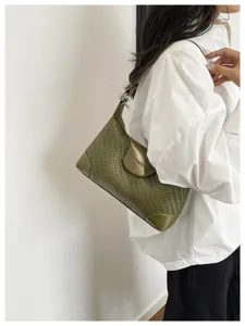 Stylish green woven leather shoulder bag for women, trendy hobo handbag for daily commute.