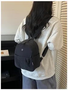 Casual black mini backpack detail view, compact daily commuting daypack for women.