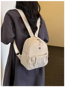 Minimalist Japanese casual backpack for women, lightweight and stylish daily commuting bag.