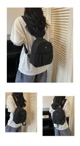 Detailed view of the stylish minimalist black backpack for women, perfect for daily commute.