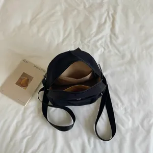 Japanese minimalist black backpack for women, lightweight commuter casual shoulder bag main view.