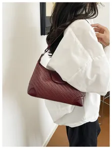 Women's woven leather underarm shoulder bag, elegant vintage style handbag for daily commute.