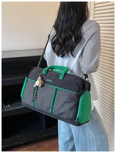 Detailed view of the stylish black and green grid travel bag showing great capacity.