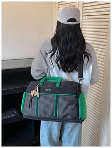 Large capacity travel duffel bag, stylish fitness gym bag with strap for sports and short trips.