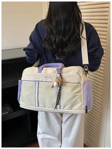 Large capacity canvas travel duffel bag, stylish lightweight sports gym bag for short trips.