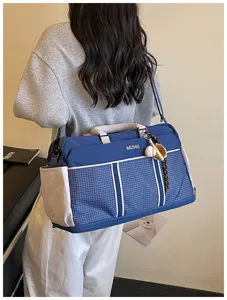 Large capacity travel duffel bag in blue grid design, perfect for gym, sports, and short trips.