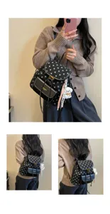 Detailed view of the stylish polka dot casual backpack, featuring front pocket and cute puppy pendant.