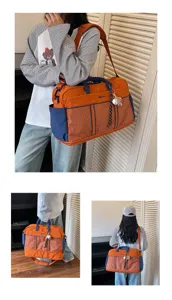 Large capacity travel duffel bag in orange blue plaid, ideal for short trips and daily gym use.