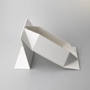 Close-up detail of white foldable gift box, premium cardboard material for packaging.