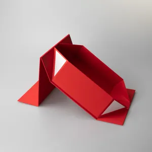 Red foldable gift box detail shot showing collapsible rigid structure and inner white corners.