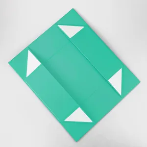 Gros plan détaillé de la boîte cadeau pliante magnétique turquoise avec un design de coin soigné.