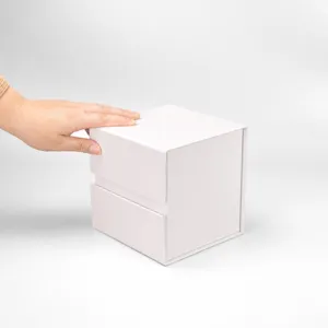 White square rigid folding gift box detail, clean paper packaging container close-up.
