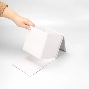 White folding gift box detail showing the collapsible structure and clean surface design.